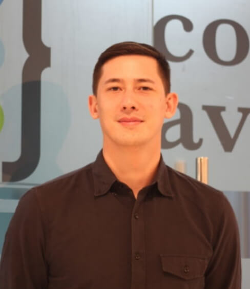 A portrait of a person indoors.