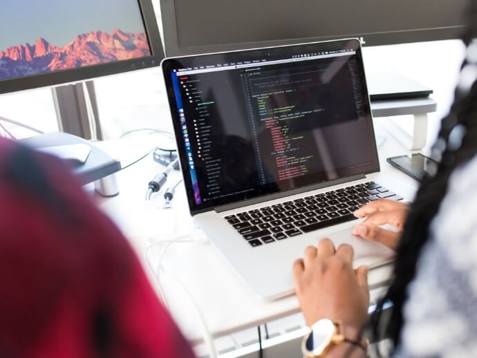 Person typing on a laptop.