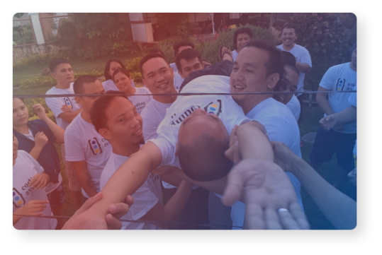 A person lifted by multiple people.