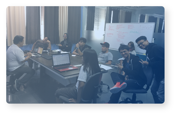 People gathered in a meeting room.